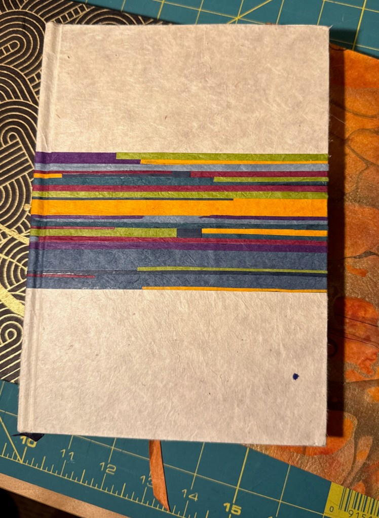 A textured light gray book cover featuring colorful horizontal stripes in purple, green, blue, and yellow.